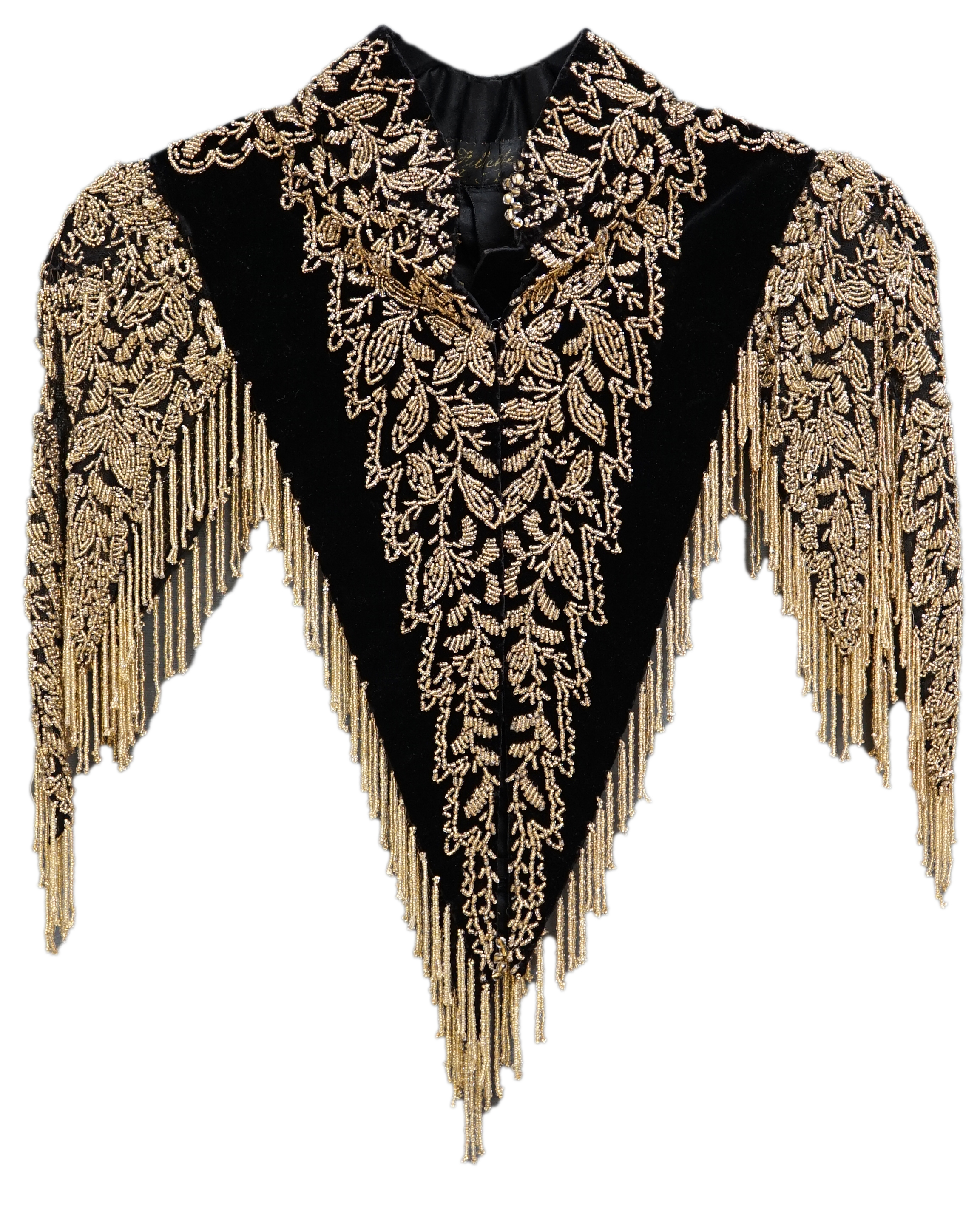 An Edwardian French black velvet and elaborately beaded evening over collar, with makers label, ‘Fillet’, designed with a high collar, front and back panels, all heavily bead worked in an intricate floral design, attache